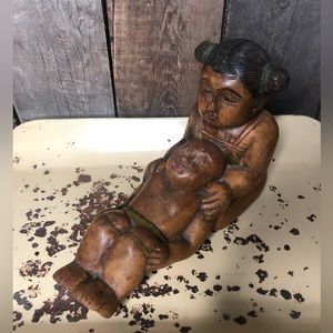 Baby Buddha, and little girl wood carving